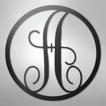 Black metal wall art with a fancy script letter "H" inside a circular frame.