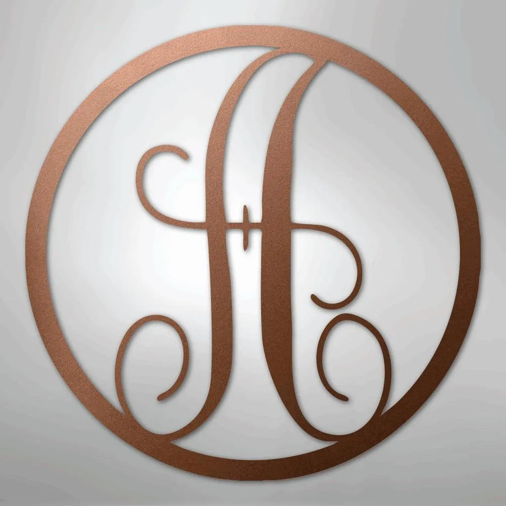Copper metal wall art with a fancy script initial "H" inside a circular frame.