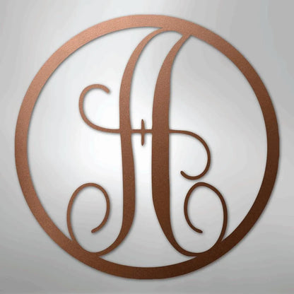 Copper metal wall art with a fancy script initial "H" inside a circular frame.