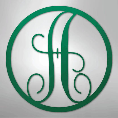 Green metal wall art with a fancy script letter "H" inside a circular frame.