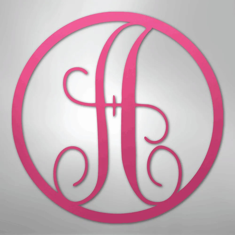 Pink metal wall art with a fancy initial "A" in a decorative circle monogram.