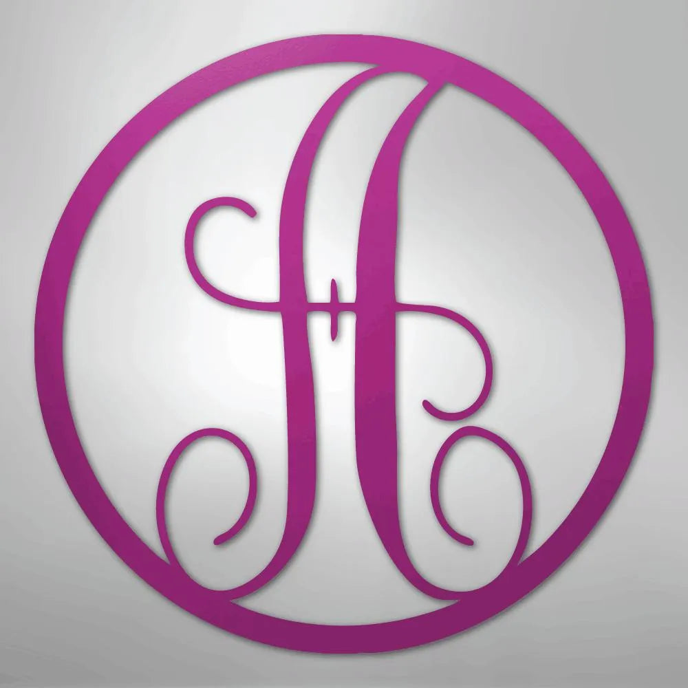 Pink metal circle monogram wall art featuring a fancy script initial "H".