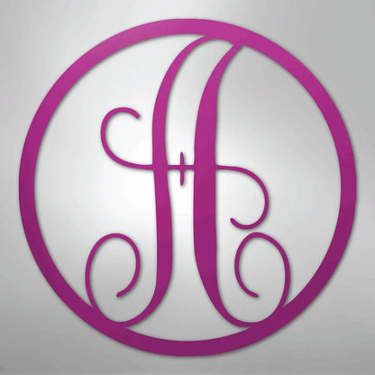 Pink metal circle monogram wall art featuring a fancy script initial "H".