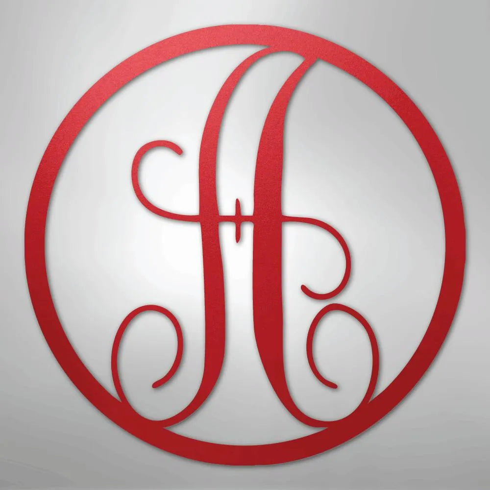 Red metal circle monogram wall art featuring a fancy script initial "H".