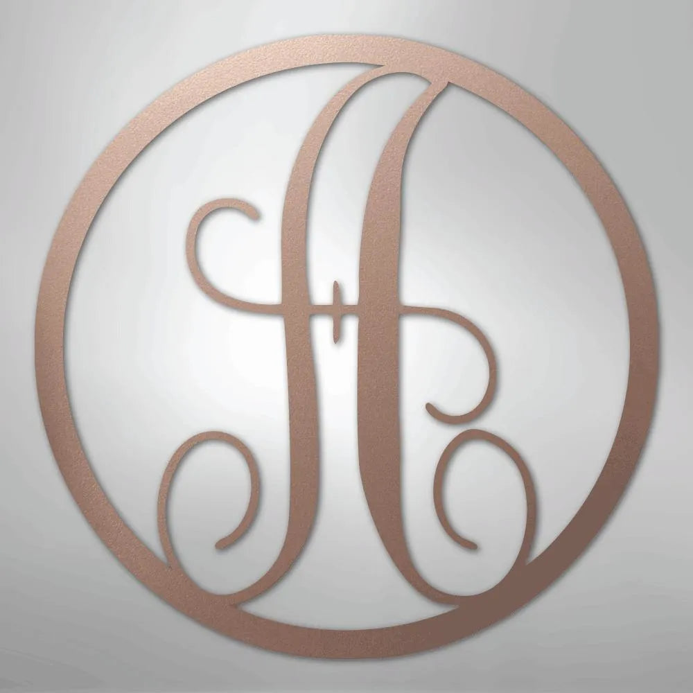 Copper metal wall art with a fancy script initial "H" inside a circular frame.