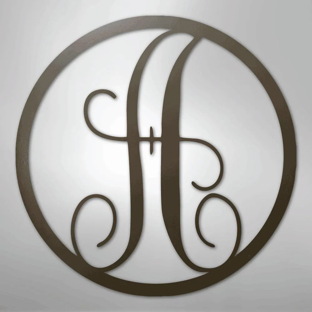Dark brown metal wall art with a fancy script initial "H" inside a circular frame.