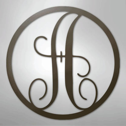 Dark brown metal wall art with a fancy script initial "H" inside a circular frame.