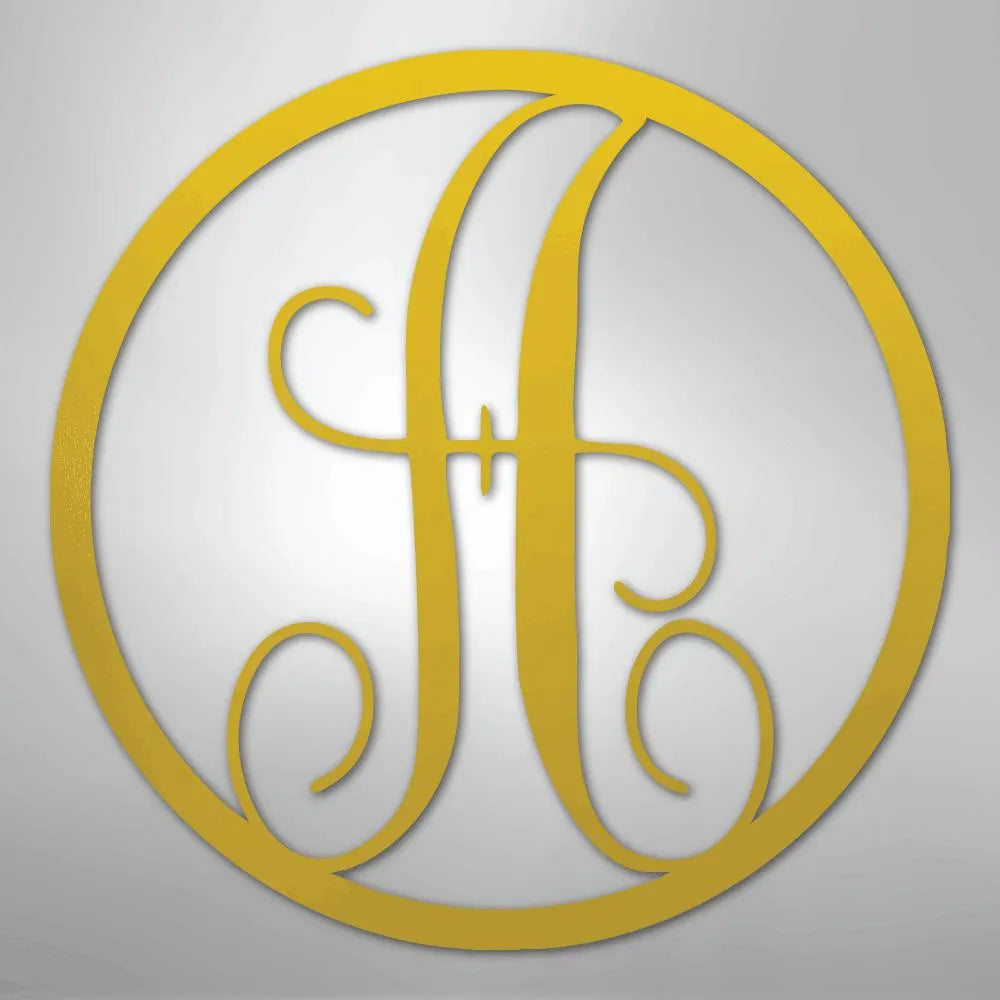 Gold metal initial "A" in a fancy script, encircled by a matching metal ring, on a light gray background.