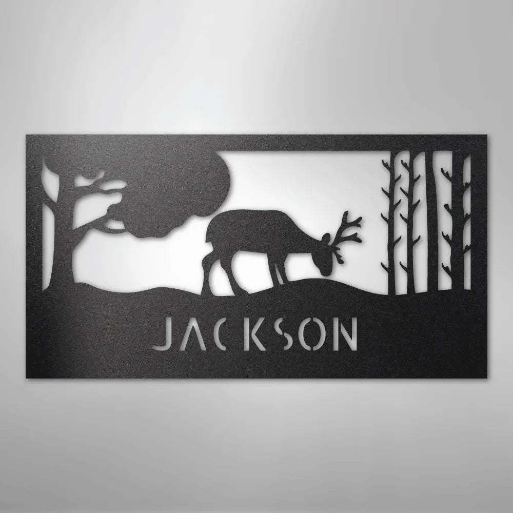 Black metal wall art featuring a grazing deer, trees, and "JACKSON" custom monogram.
