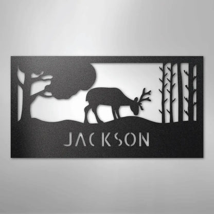 Black metal wall art featuring a grazing deer, trees, and "JACKSON" custom monogram.