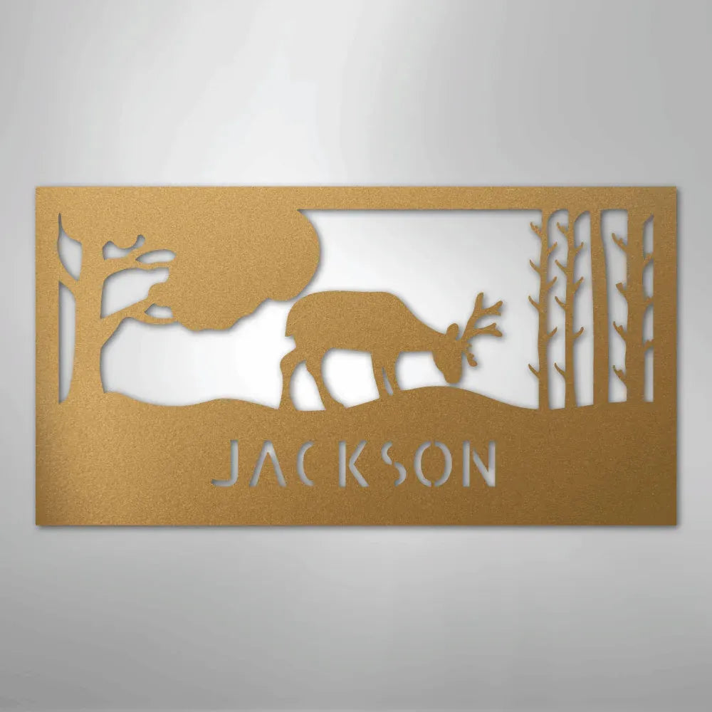 Copper metal wall art with a grazing deer, trees, and "JACKSON" personalized monogram.