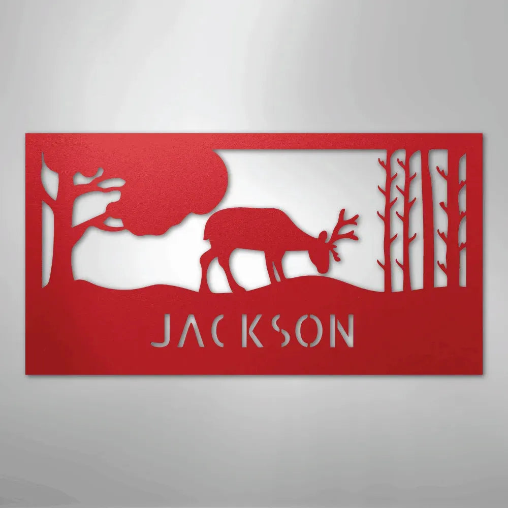 Red metal wall art featuring a grazing deer, trees, and "JACKSON" personalized monogram.