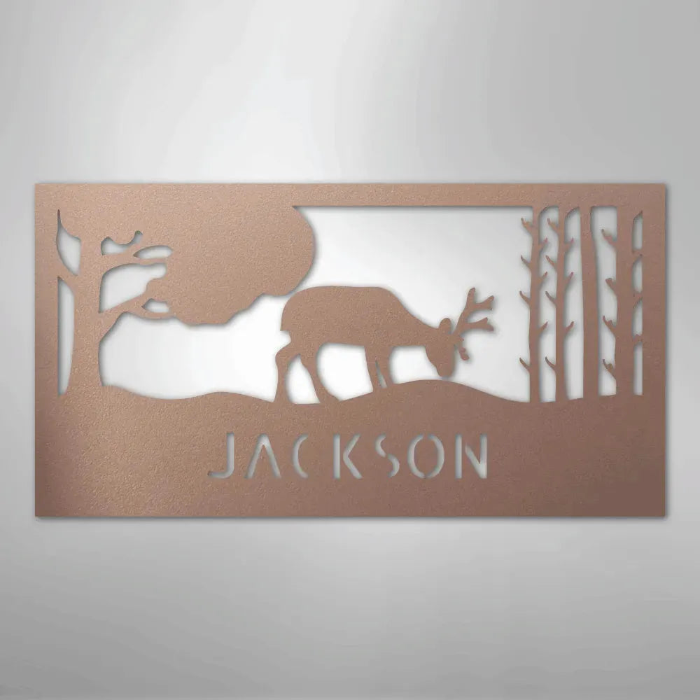 Copper metal wall art with a grazing deer, trees, and "JACKSON" custom monogram.