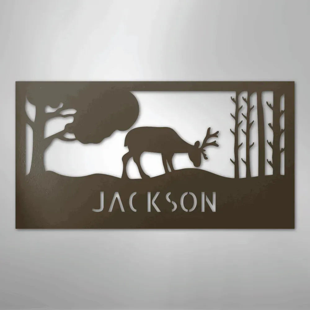 Rustic copper metal wall art with a grazing deer, trees, and "JACKSON" custom monogram.
