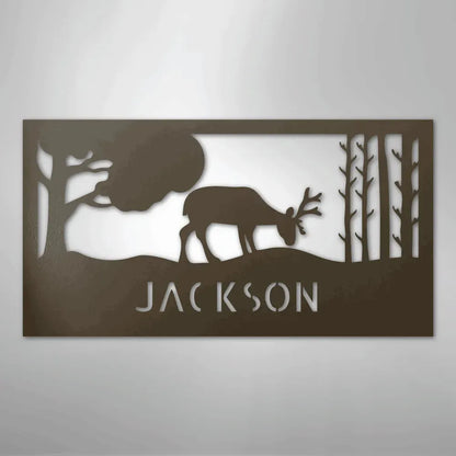 Rustic copper metal wall art with a grazing deer, trees, and "JACKSON" custom monogram.