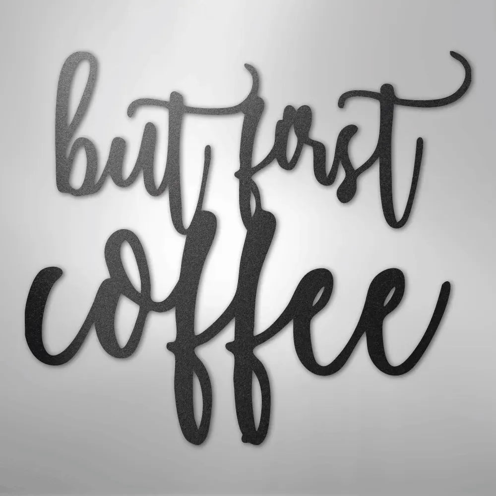Black metal wall art decor with "but first coffee" in elegant script.