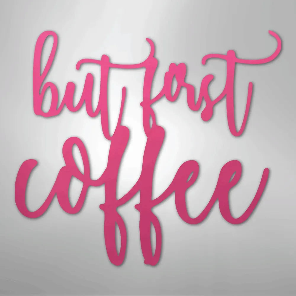 Pink metal wall art decor with "but first coffee" in elegant script.
