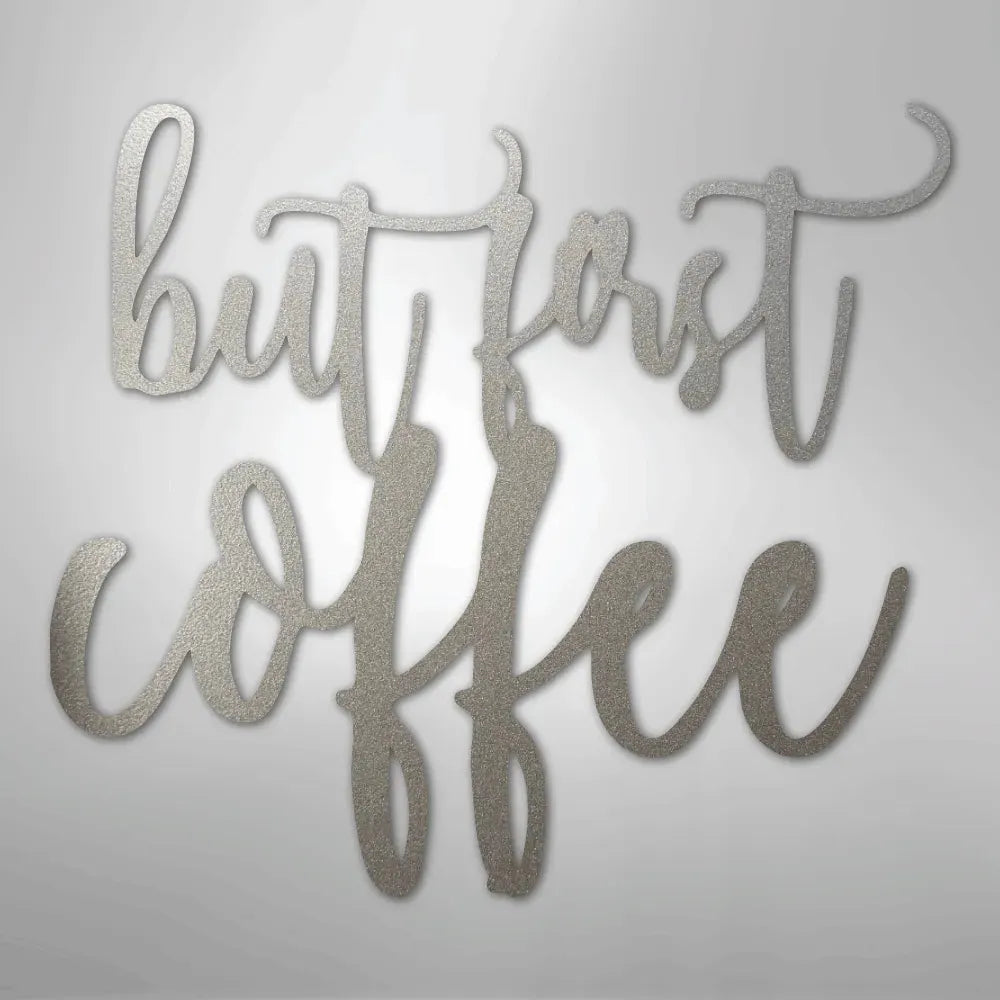 Silver "But First Coffee" metal wall art decor with a textured finish.