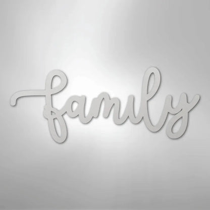 White metal "family" script wall art in a flowing cursive font.
