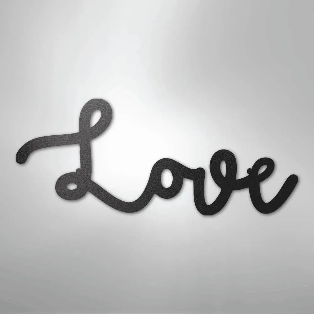 Black script "Love" metal wall art with a textured finish, casting a subtle shadow.