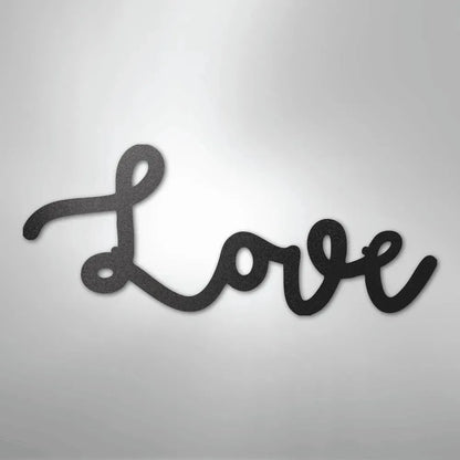 Black script "Love" metal wall art with a textured finish, casting a subtle shadow.