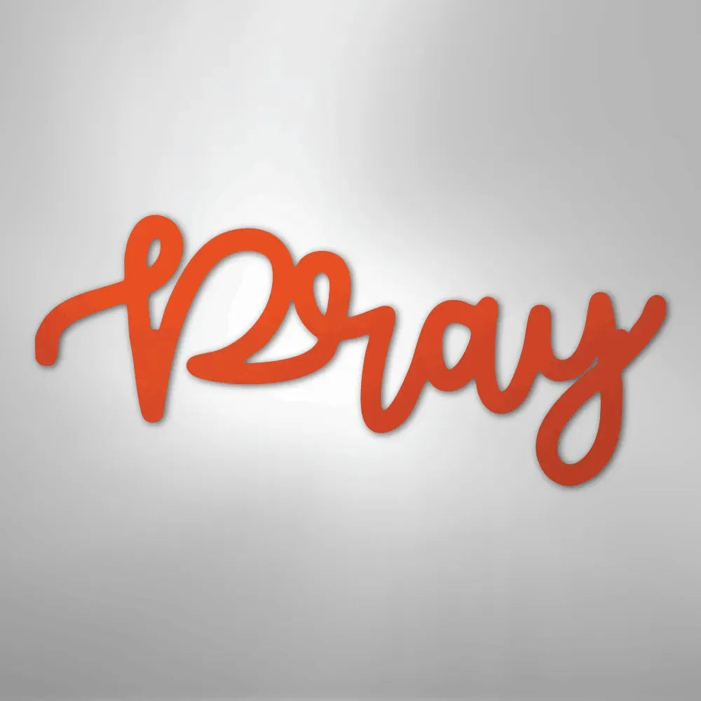 Orange "Pray" script metal wall art in a flowing, handwritten style.