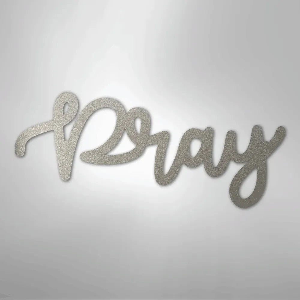 Silver "Pray" script metal wall art with a textured finish, ideal for faith-inspired home decor.