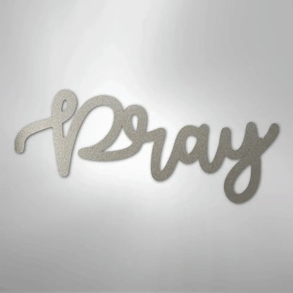 Silver "Pray" script metal wall art with a textured finish, ideal for faith-inspired home decor.