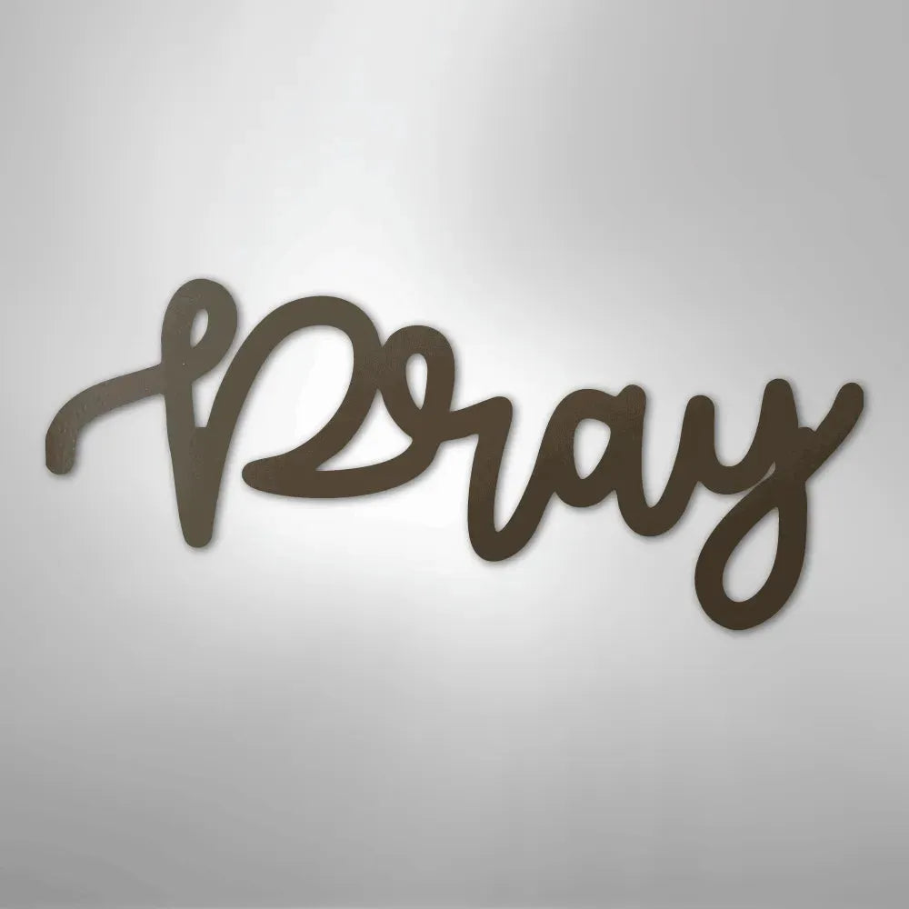 Dark brown metal "Pray" script wall art with a smooth finish, casting a subtle shadow.