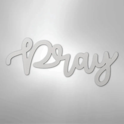 White metal "Pray" script wall art in a flowing, elegant font.