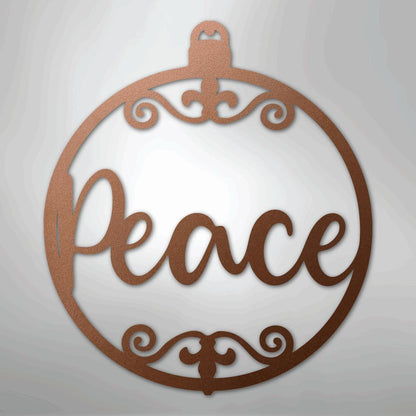 Copper-colored metal wall art shaped like a Christmas ornament with "Peace" in script and decorative flourishes.