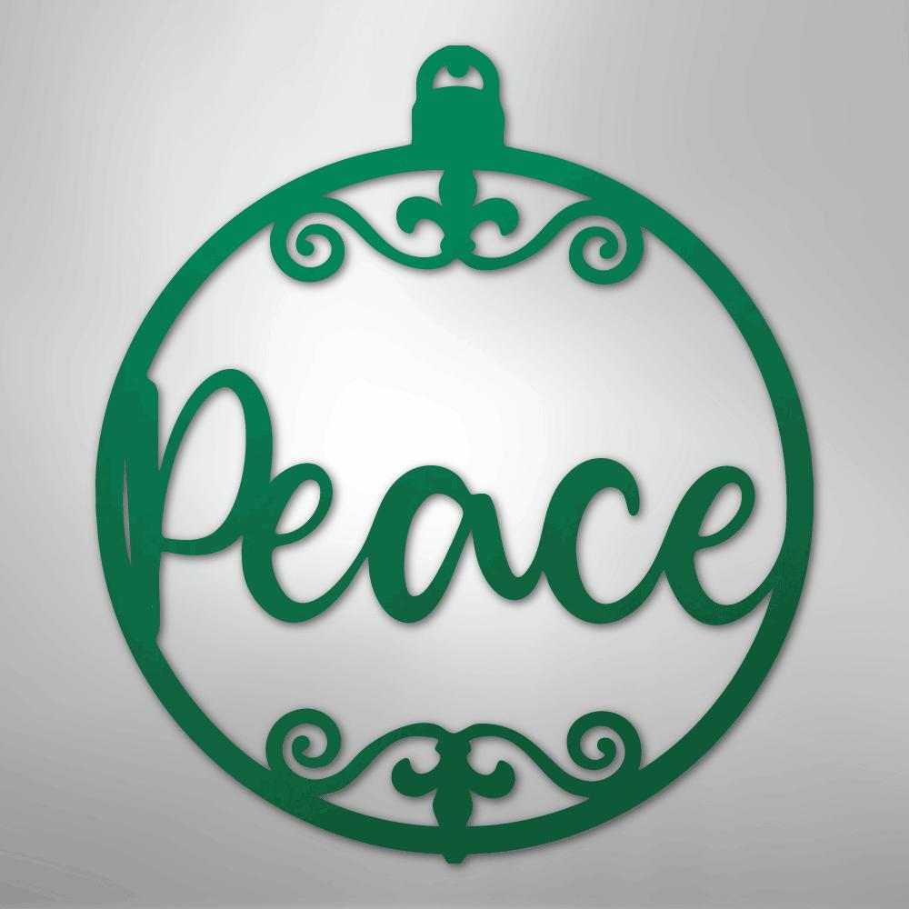 Green metal Christmas ornament wall art with "Peace" in script and scrollwork.
