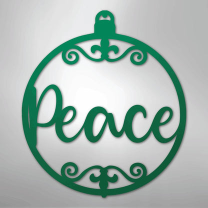 Green metal Christmas ornament wall art with "Peace" in script and scrollwork.