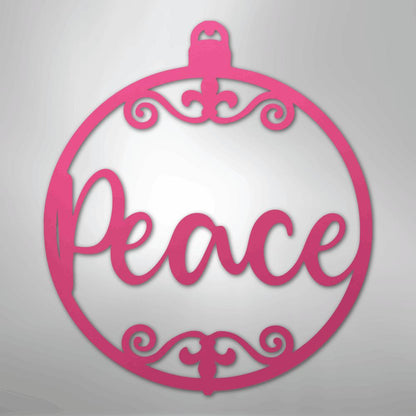 Pink metal Christmas ornament wall art with "Peace" in script and decorative swirls.