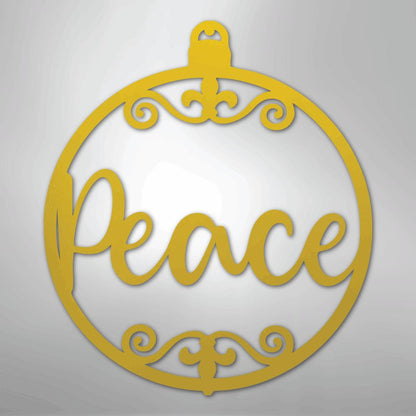 Gold metal Christmas ornament wall art with "Peace" in script and decorative flourishes.