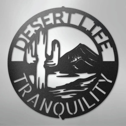 Black metal "Desert Life Tranquility" wall art with saguaro cactus and mountain design.