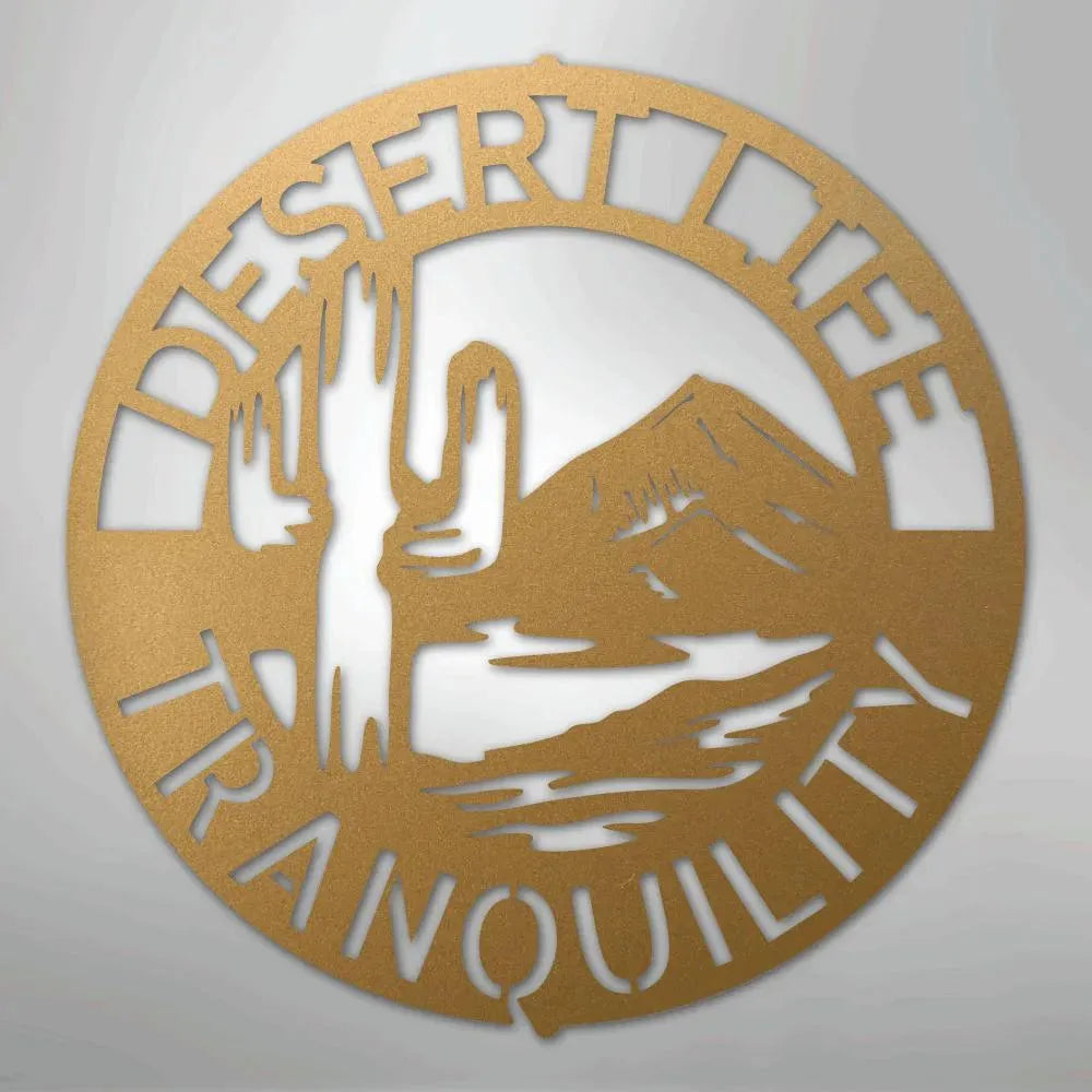 Gold metal wall art with "DESERT LIFE TRANQUILITY" text, saguaro cactus, and mountain design.