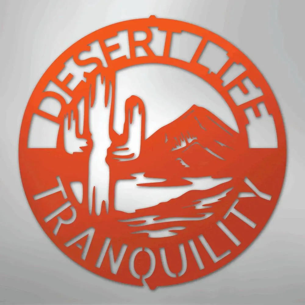 Orange metal wall art with "DESERT LIFE TRANQUILITY" text, saguaro cactus, and mountain design.