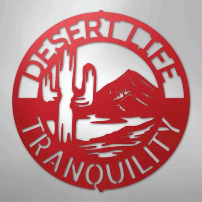 Red metal "Desert Life Tranquility" wall art with saguaro cactus and mountain design.