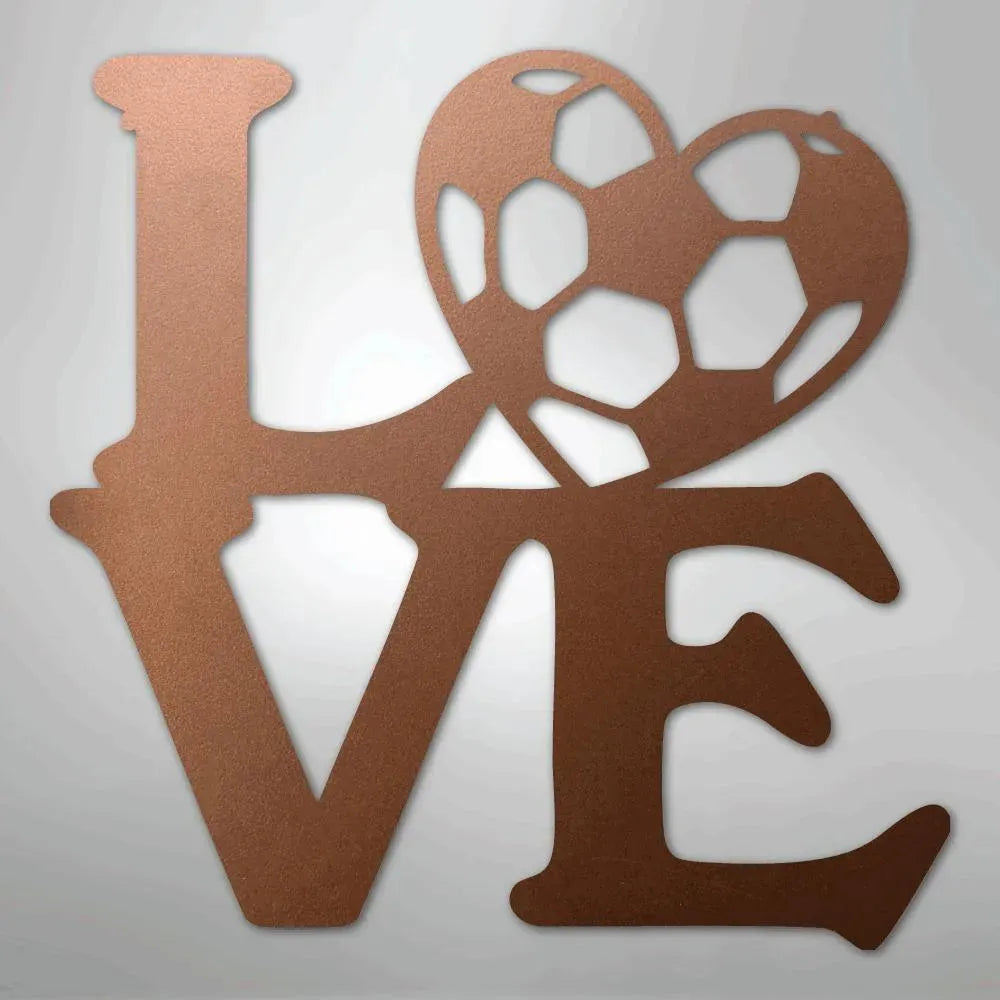 Copper-colored metal wall art spelling "LOVE" with a soccer ball heart.