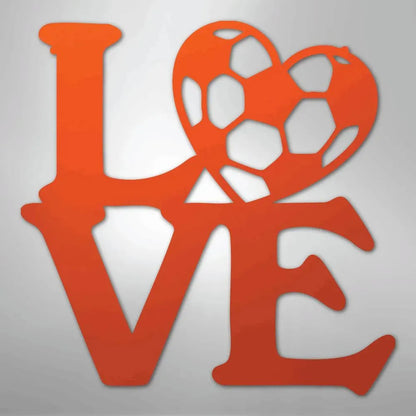 Orange metal "LOVE" wall art with a soccer ball forming the heart, on a gray background.