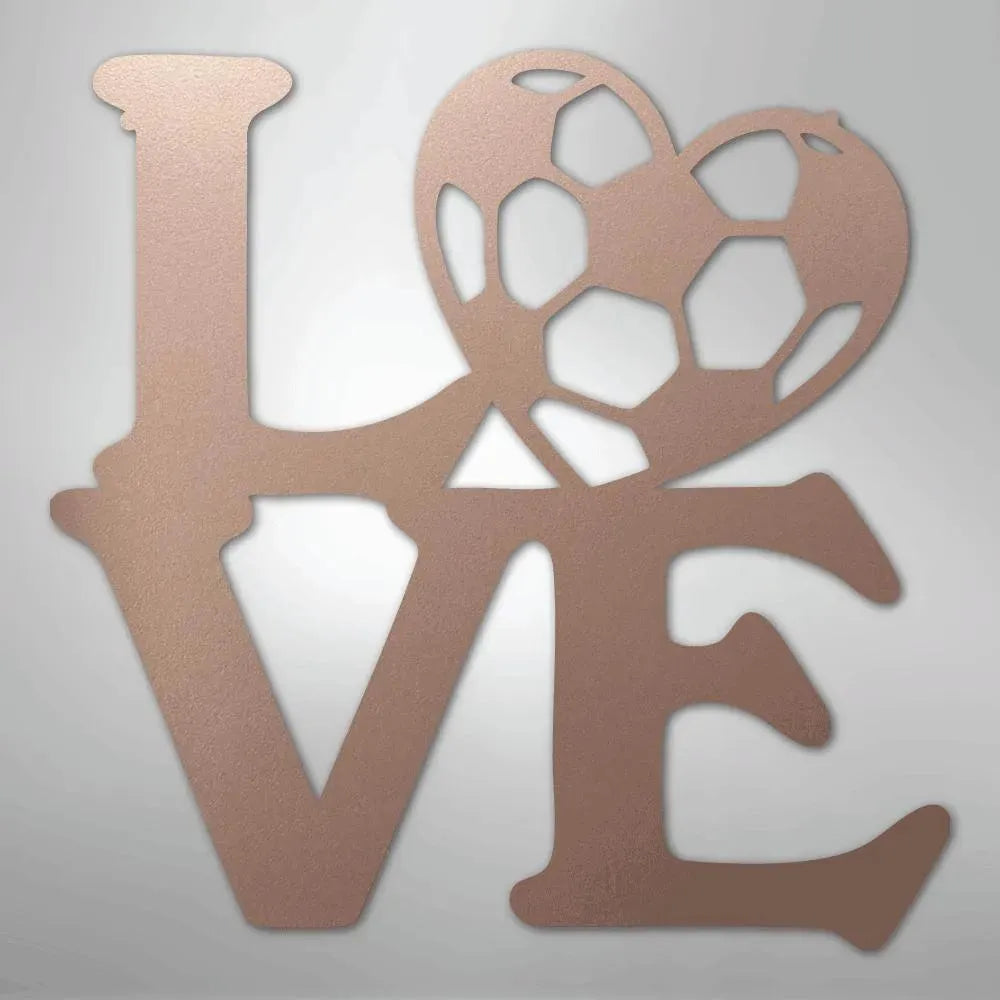 Rose gold metal "LOVE" wall art with a soccer ball heart.