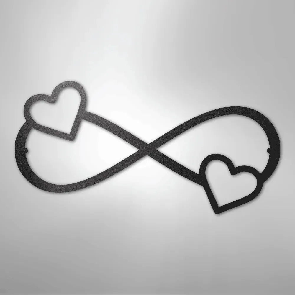 Black metal infinity symbol wall art with two hearts, one on each loop.
