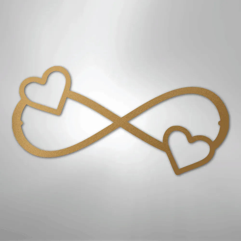 Gold metal infinity symbol with two hearts, one at each end, for home decor.