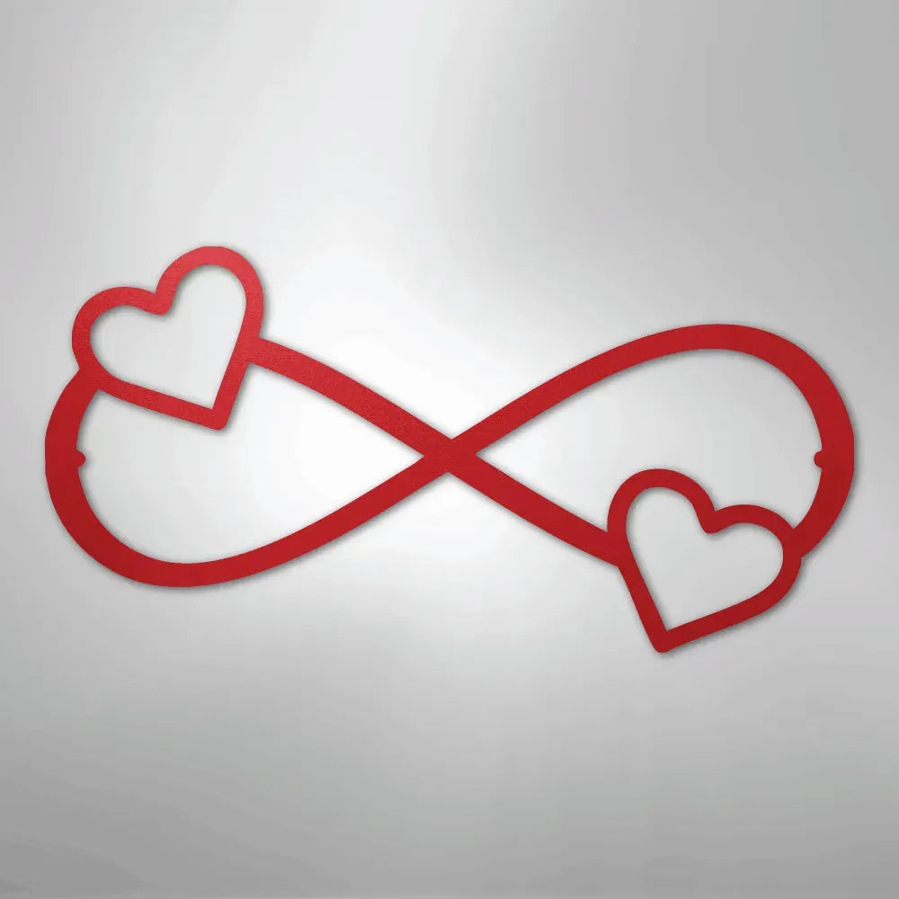 Red metal infinity symbol wall art with two hearts, one on each loop.