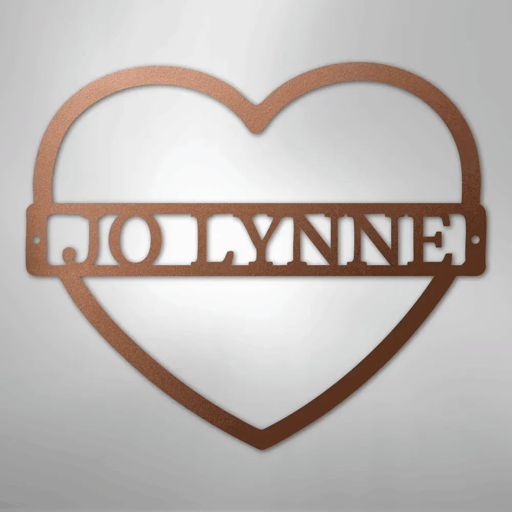 Copper heart-shaped metal wall art with the custom name "JOLLYNNE" cut out in the center.