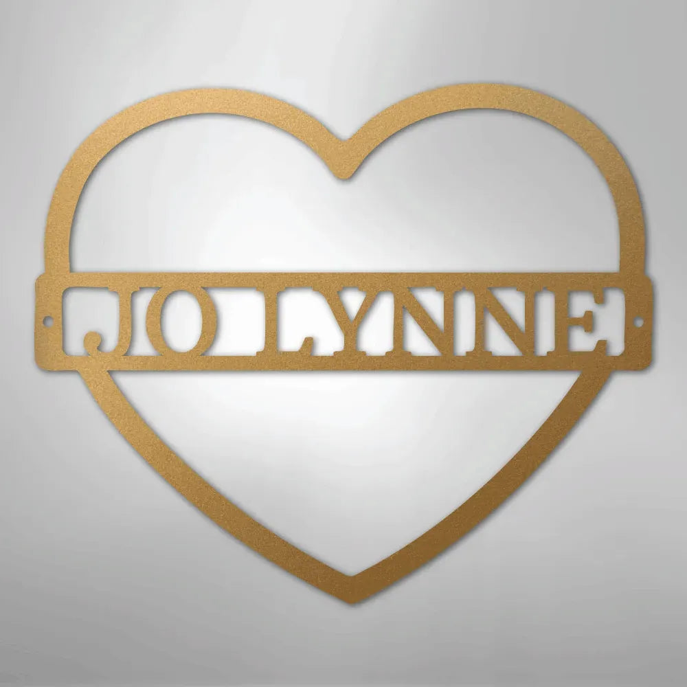 Gold heart-shaped metal wall art with the custom name "JOLLYNNE" cut out in the center.