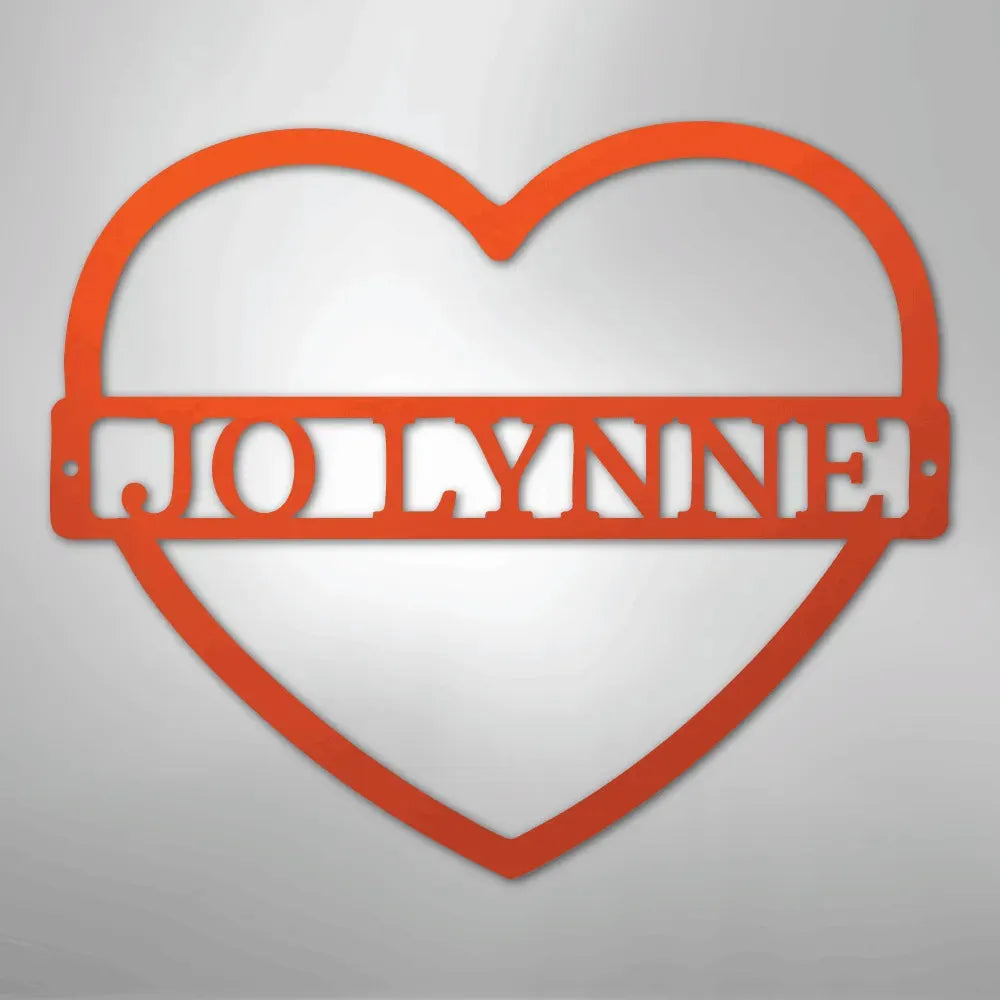 Red heart-shaped metal wall art with "JOLYNNE" cut out in the center.
