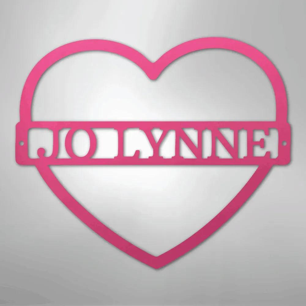 Pink heart-shaped metal wall art with "JOLLYNNE" custom monogram.