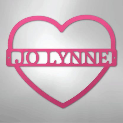 Pink heart-shaped metal wall art with "JOLLYNNE" custom monogram.